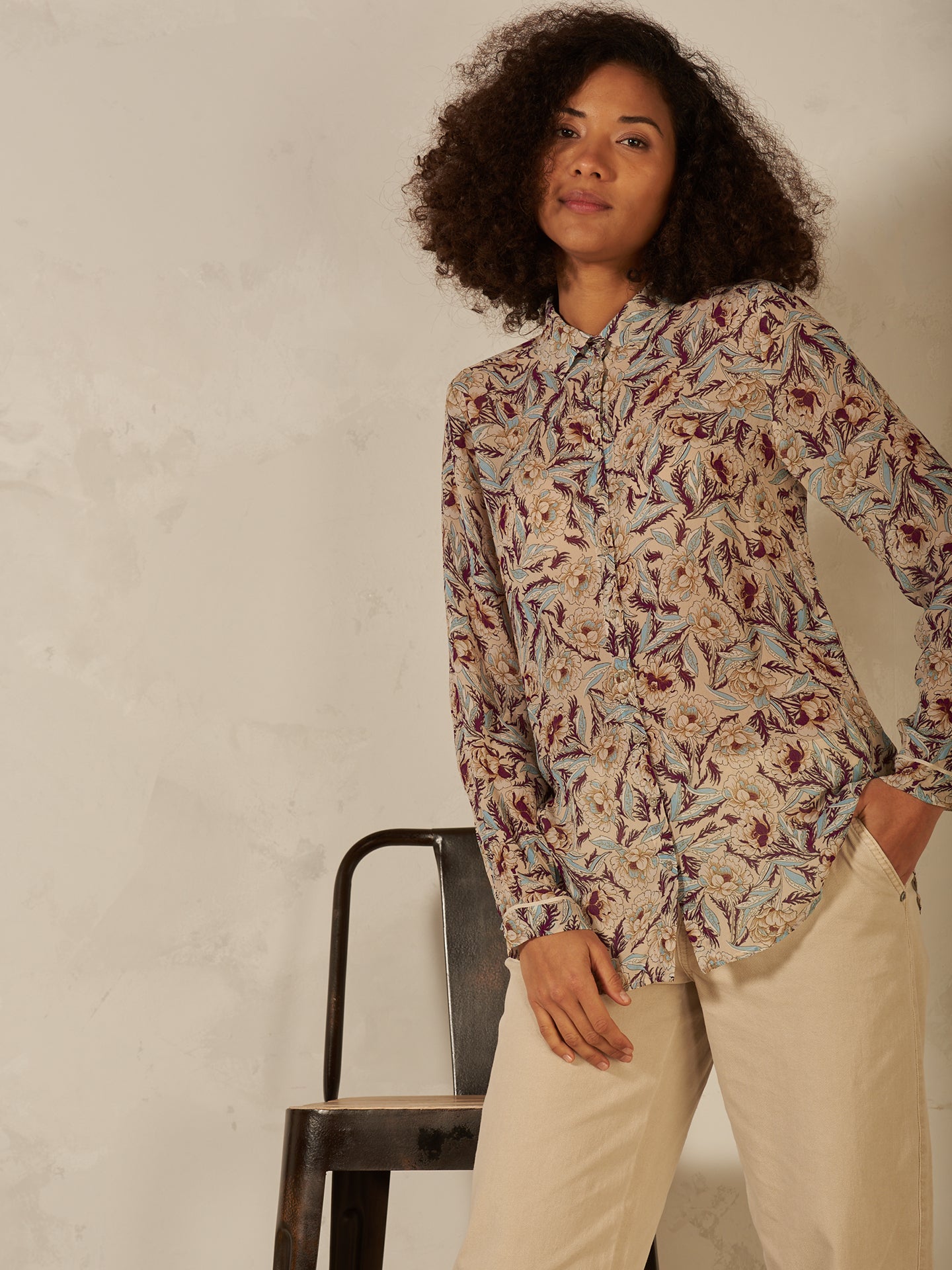 Blusa con abbottonatura