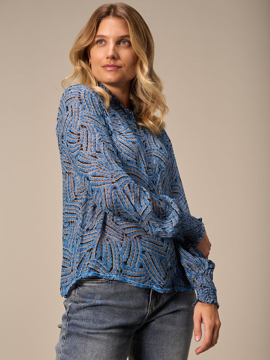 Blusa con dettaglio a balze