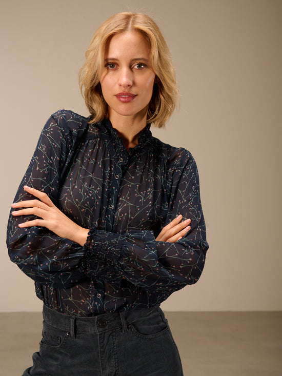 Blusa con dettaglio a balze