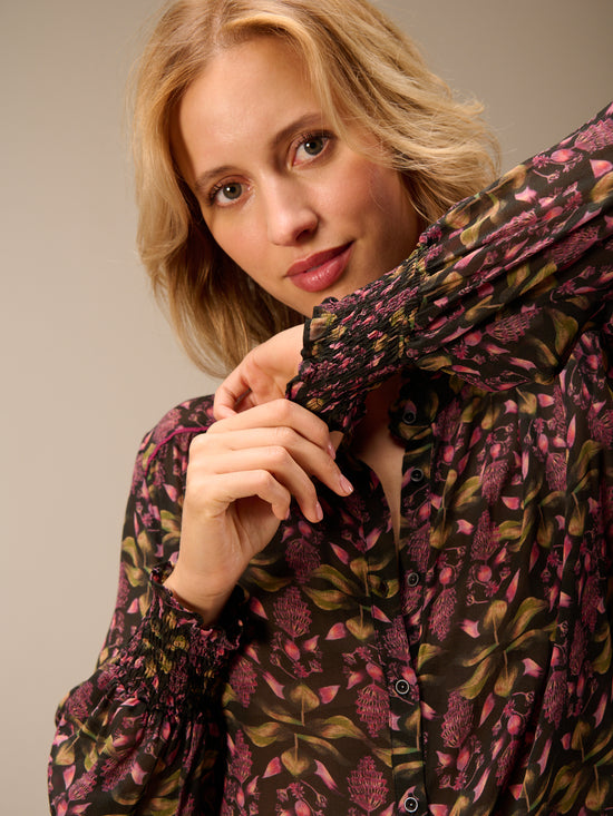 Blusa con dettaglio a balze