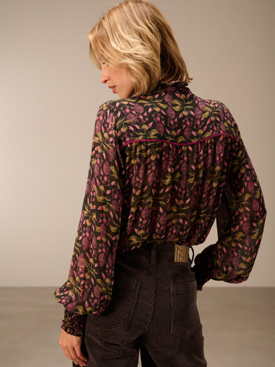 Blusa con dettaglio a balze