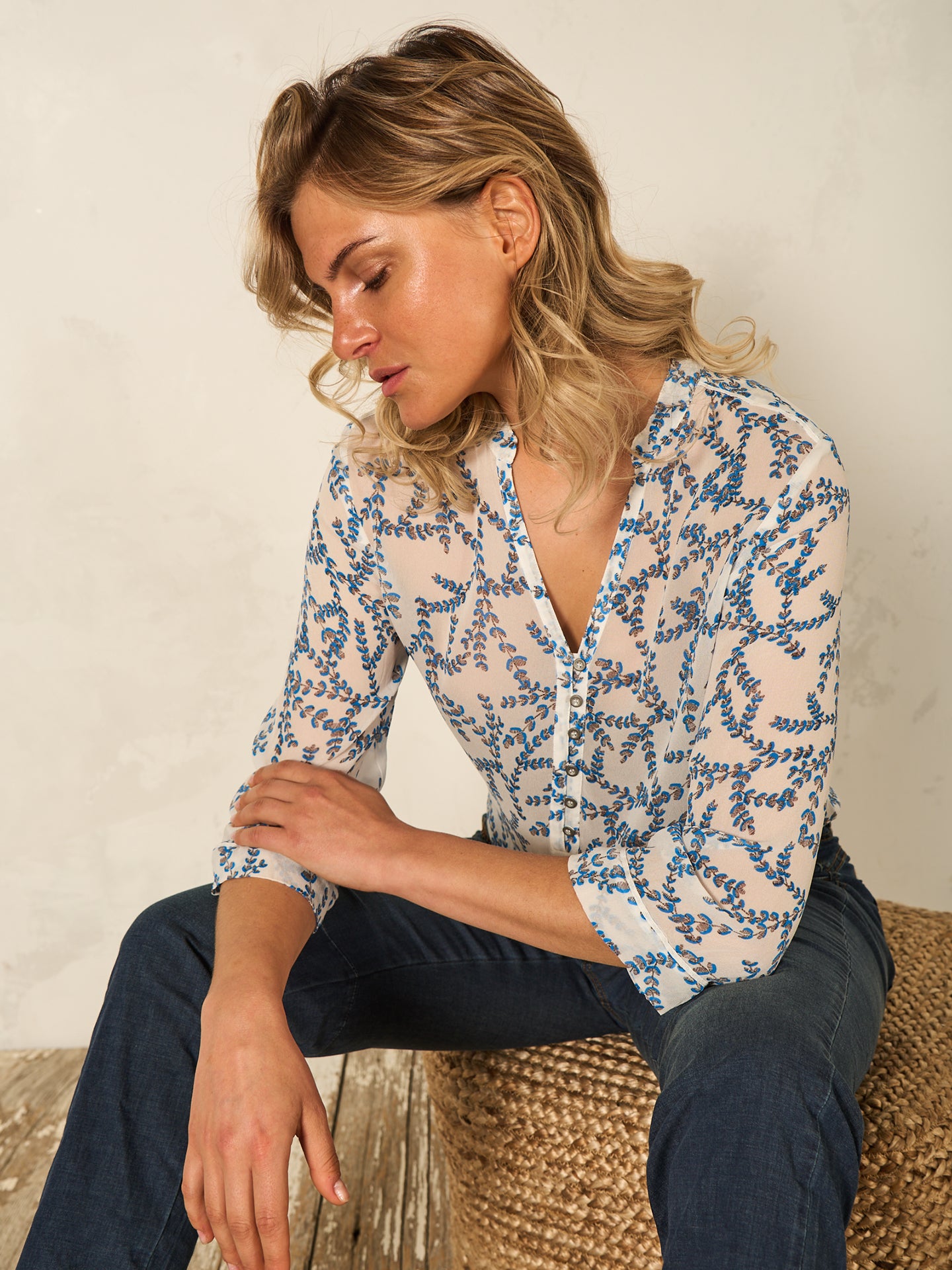 Blusa con abbottonatura