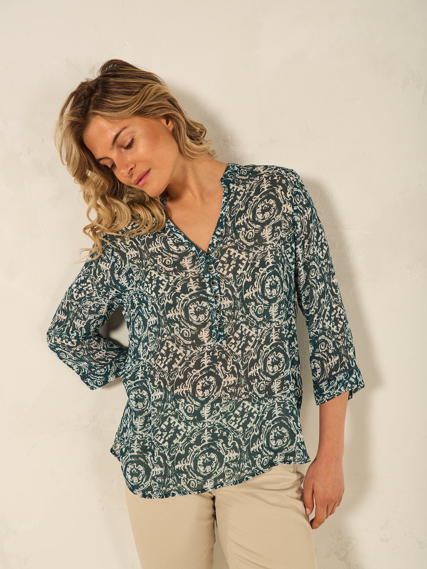 Blusa con abbottonatura