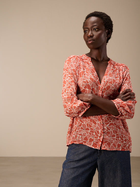 Blusa con abbottonatura