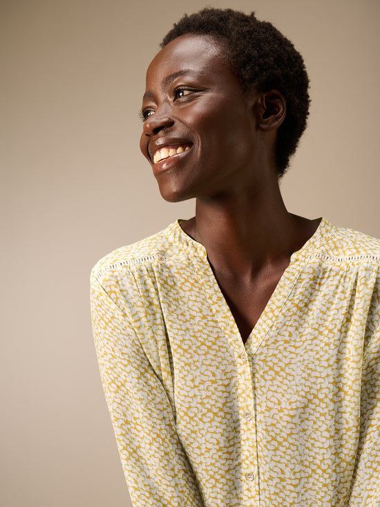Blusa con abbottonatura