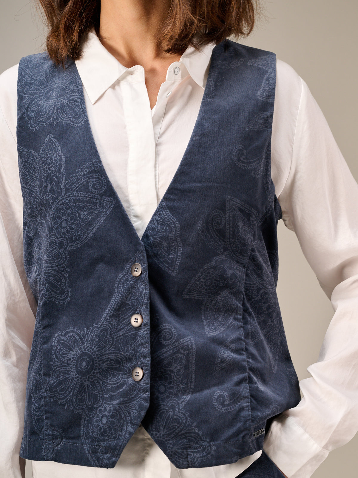 Gilet con chiusura con bottoni